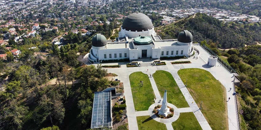 View of the Griffith Observatory from above showing its entire structure and the areas around
