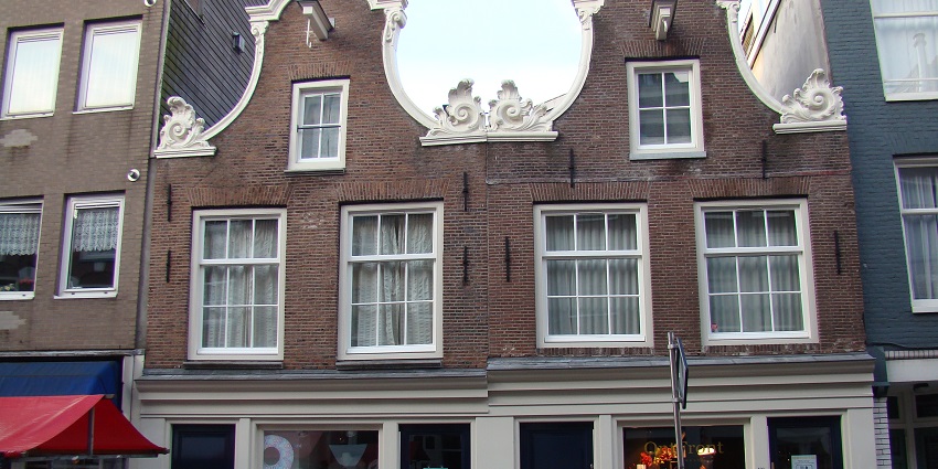 Vibrant street with diverse shops, cafes, and speciality stores.