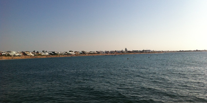 Relaxing beach destination with clear waters, perfect for leisure.