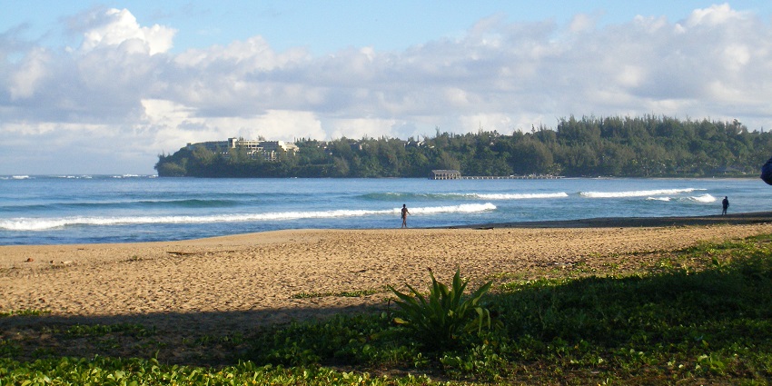 A picture of Hanalei Bay with golden sands, perfect for Valentines Day in Hawaii.