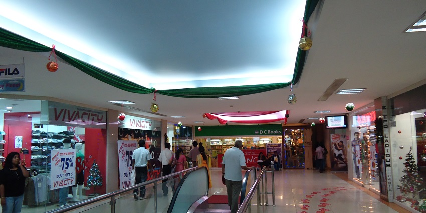 Small shopping complex with various retail shops and eateries.
