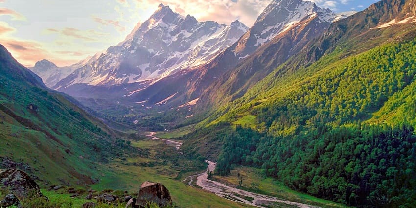 Picturesque valley trek with stunning views of snow-covered peaks.