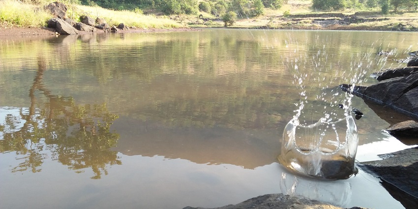 A picture of the lake at Harihargad Fort, offers scenic Igatpuri trekking through forests.