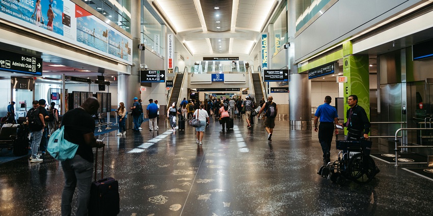 Interior of Heraklion International Airport with the people on the check-in counters