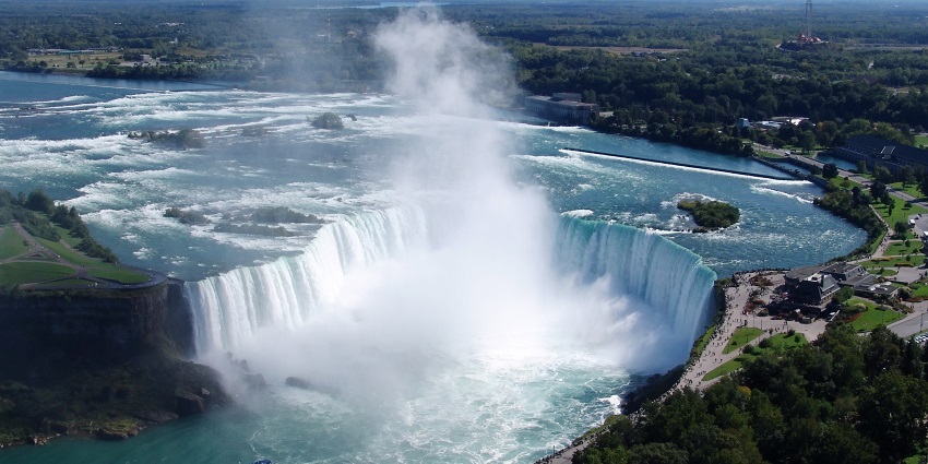 An image of a waterfall surrounded by hills, a popular destination near Niagara Falls, Canada