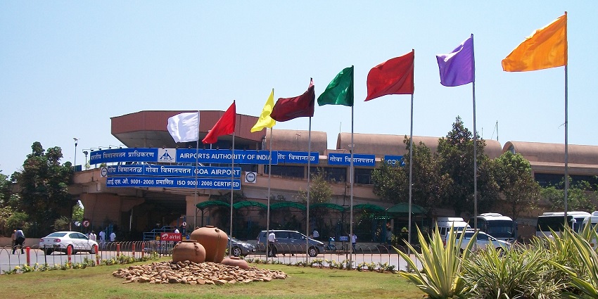 Entrance to Goa International Airport showcasing modern architecture and bustling activity