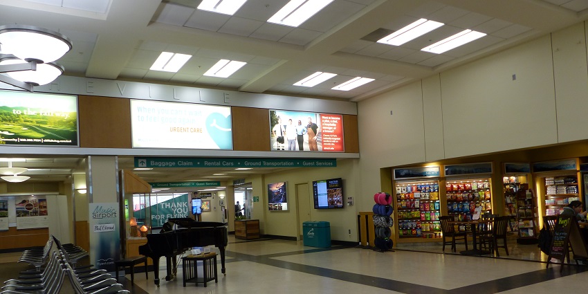 Interior view of Asheville Regional Airport with spacious seating area and large windows