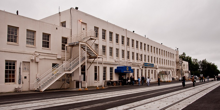 A view of Anchorage Station with railroad tracks running in front of the building in Alaska
