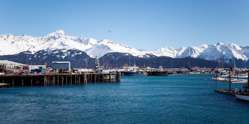 An image of snow-capped mountains rising majestically, framing the stunning beauty