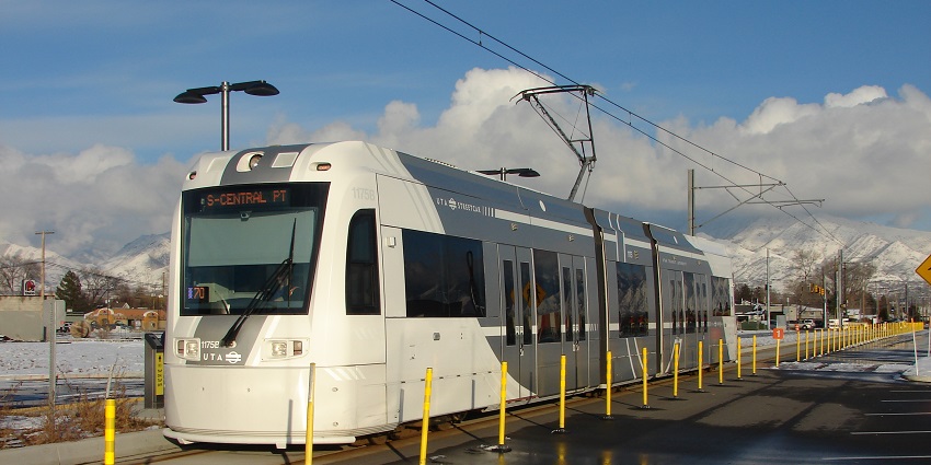 An image of a front view of a light rail train at South Salt Lake City station.