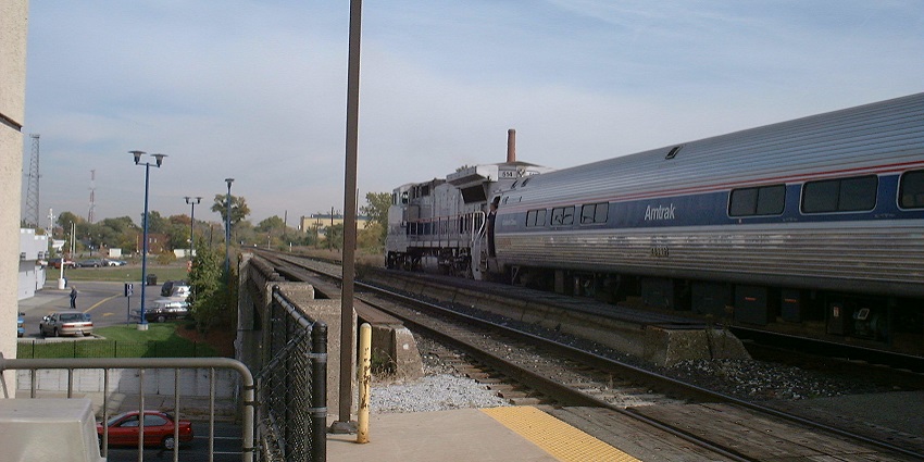 An exterior view of the Detroit Amtrak Station during the day, featuring modern architecture.