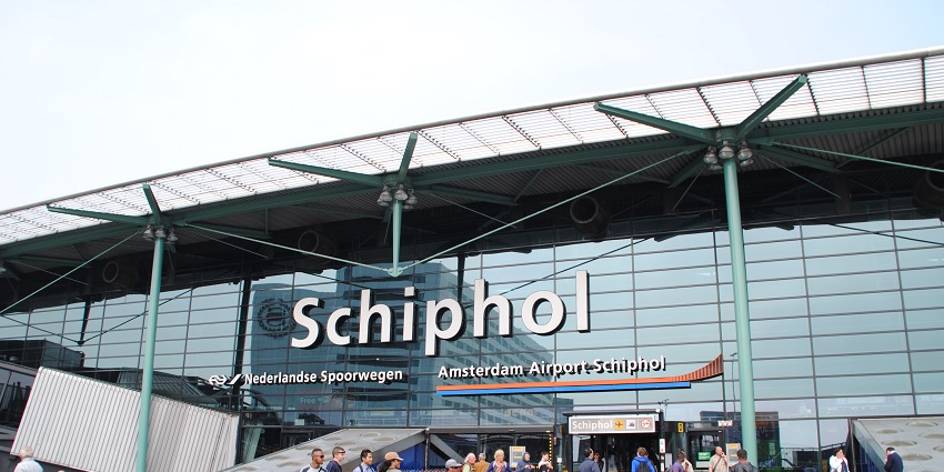 Image of Amsterdam Schiphol Airport entrance - Travel to the Corpus Museum by air, rail, and road