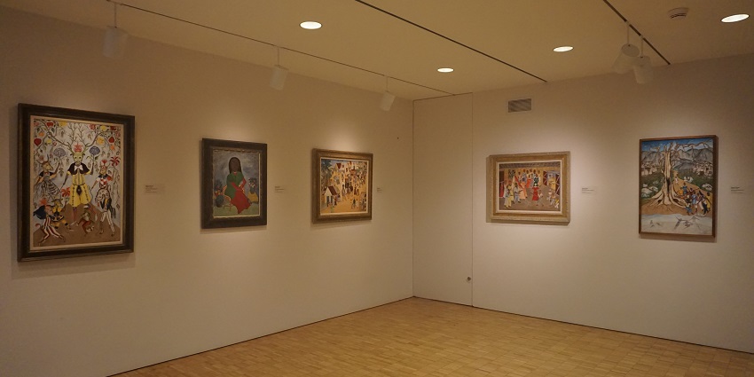 The Art of Haiti exhibit at the Milwaukee Art Museum, showcases vibrant artworks.