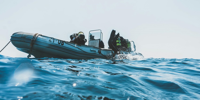 An image of the adventurers having the time of their lives while on Tarkali scuba diving.