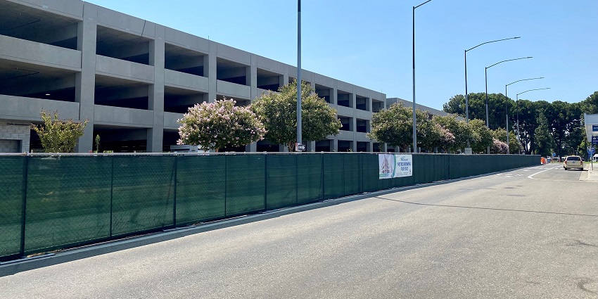 Construction of the parking garage at Fresno Airport, with scaffolding and cranes.