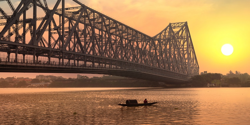 A picture of the iconic Howrah Bridge, visible from the area.
