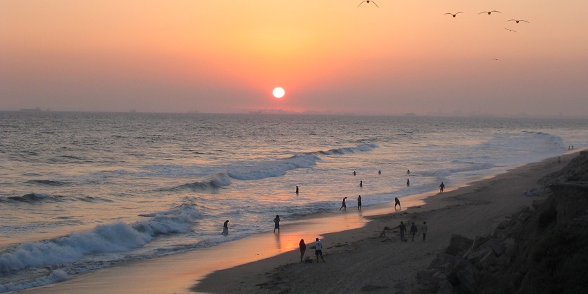 An image showing a sunset view at Huntington Beach located in California