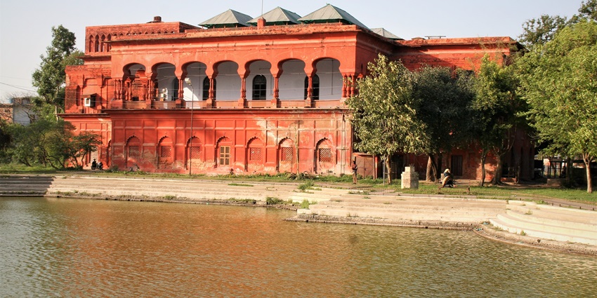 Ornate Hussainabad Picture Gallery showcases royal portraits in a grand heritage building.