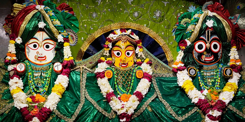 An amazing image of Lord Jagannath, Balaram, and Subhadra in an ISKCON temple
