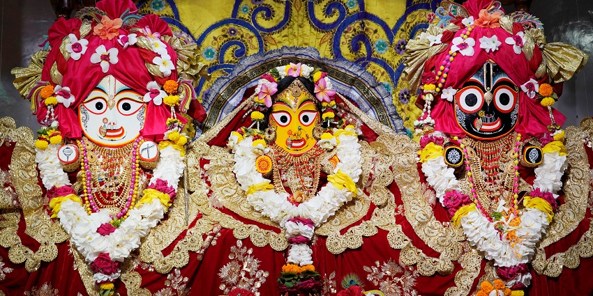 An amazing image of Lord Jagannath, Balaram, and Subhadra in an ISKCON temple