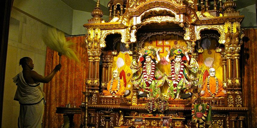 Peaceful temple with serene garden, dedicated to Lord Krishna.