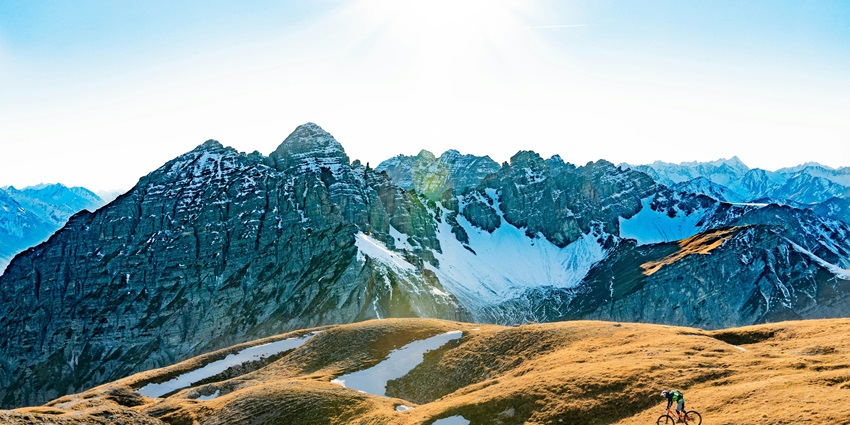 A view of Innsbruck surrounded by mountains, showcasing places to visit in Austria.