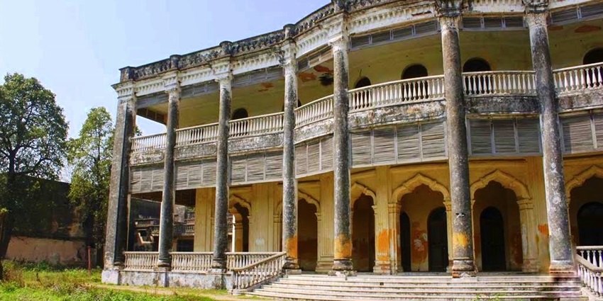 Historic Kothi Khas Bagh colonial palace with red brick façade and lush garden grounds