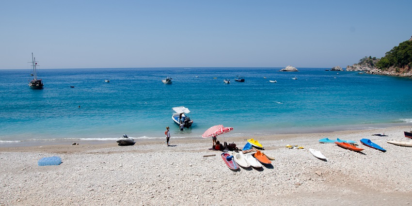 The beaches in Turkey with crystal-clear waters and stunning surrounding cliffs.