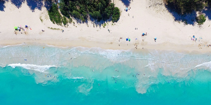 A view of Kailua Beach - one of the beaches in Hawaii with vibrant skies and calm waters.