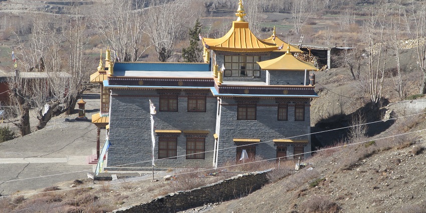 A serene view of Kali Mandir monastery, with traditional architecture.