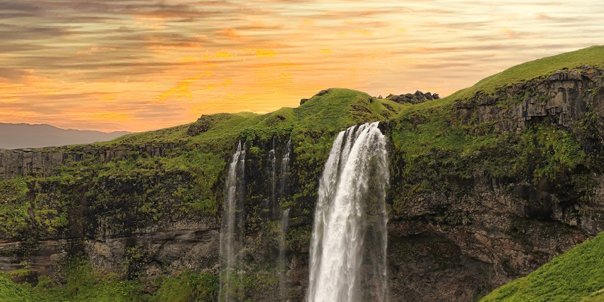 An image of a waterfall which looks similar to the Kalihiwai Falls located in Kauai.