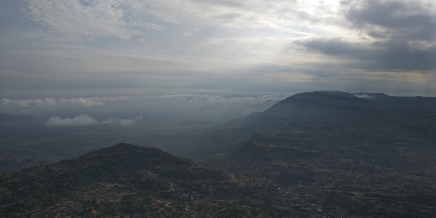 A picture of sunrise from Kalsubai Peak, showcasing the beauty of Bhandardara Trekking trails.