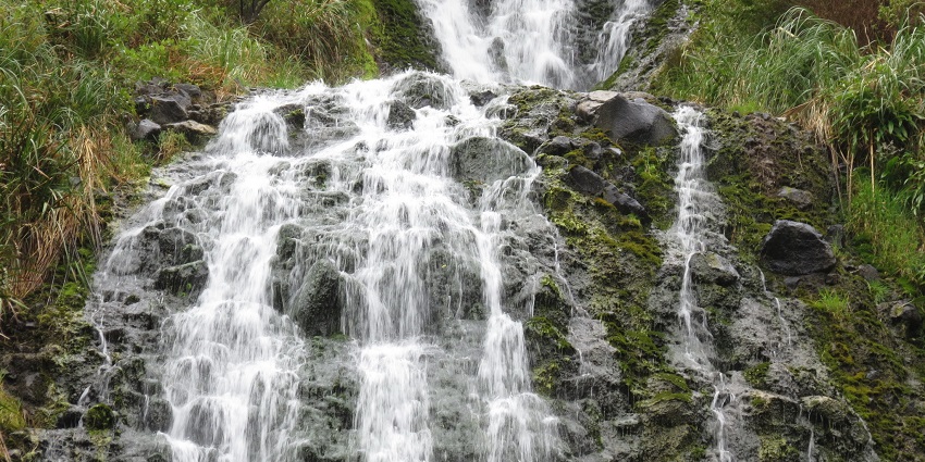 Secluded Karekare Falls near Piha is a peaceful escape into New Zealand nature.