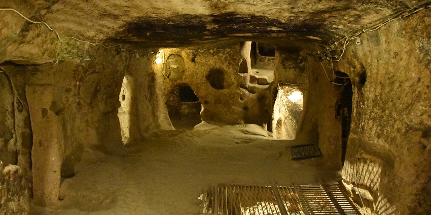 Ancient subterranean city with rooms, tunnels, and historical significance
