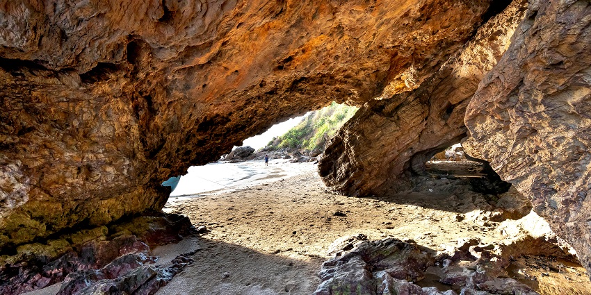 Nainital caves near Khurpatal Lake are surrounded by lush, serene nature.