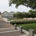 An image of the Kimbell Art Museum, showcasing its beautiful gardens and unique design