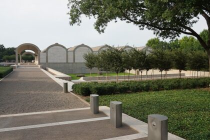 An image of the Kimbell Art Museum, showcasing its beautiful gardens and unique design