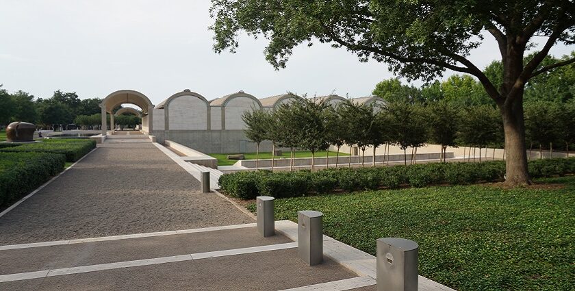 An image of the Kimbell Art Museum, showcasing its beautiful gardens and unique design