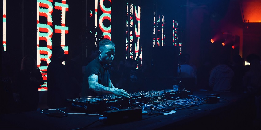 An image of an energetic nightclub featuring top DJs, eclectic music and ambience.