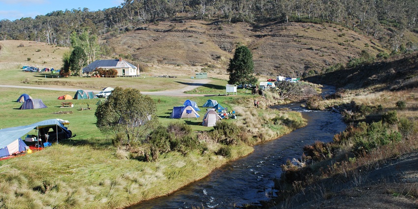Tranquil riverside camping is ideal for relaxation and nature enthusiasts.