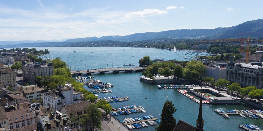 Scenic lake with boat rides and stunning city views.
