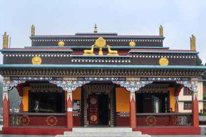 An image of Lava Monastery nestled in the Himalayan foothills, showcasing its architecture