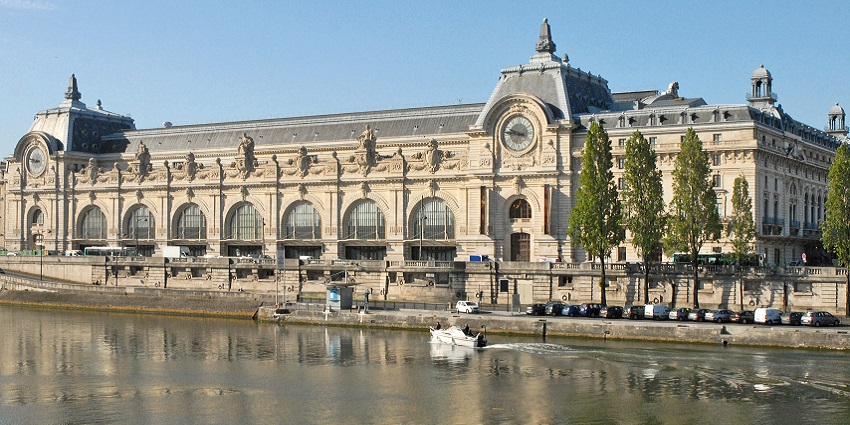 The French museum in Paris beside the lake with a grand clock overlooking the seine