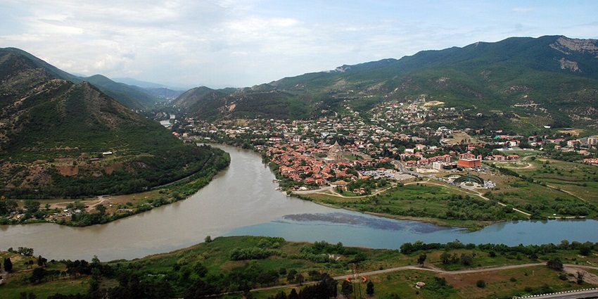 Jvari Monastery atop a hill offering panoramic views of river convergence.