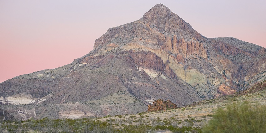 Beautiful sunset across rugged mountains and desert terrain at Big Bend National Park