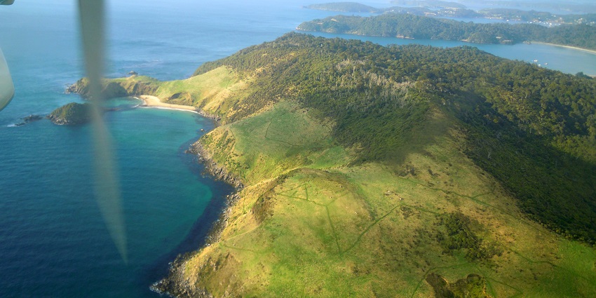 Image of out of a window on a plane view to Stewart Island in New Zealand.