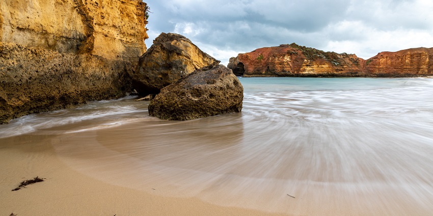 An adventurous visit to Port Campbell National Park surrounded by rocks under blue sky