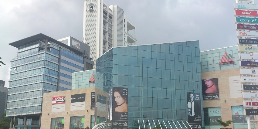  A picture of a plaza at Koregaon Park, Pune, with numerous malls and cafes