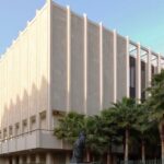 Exterior view of the Los Angeles County Museum of Art, with palm trees and modern sculptures