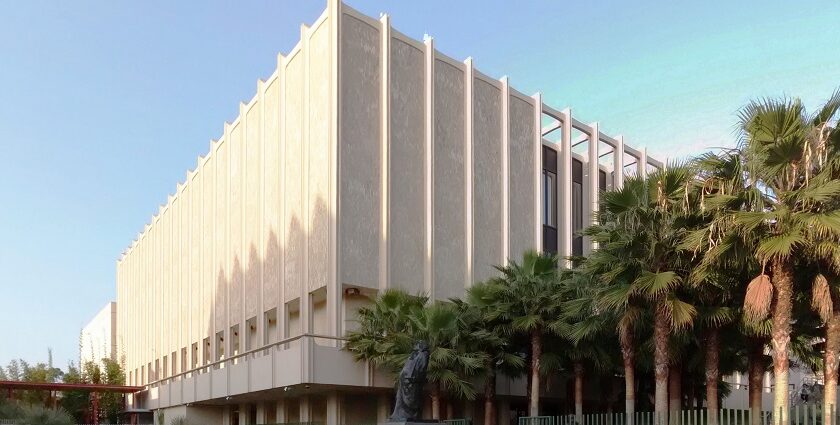 Exterior view of the Los Angeles County Museum of Art, with palm trees and modern sculptures